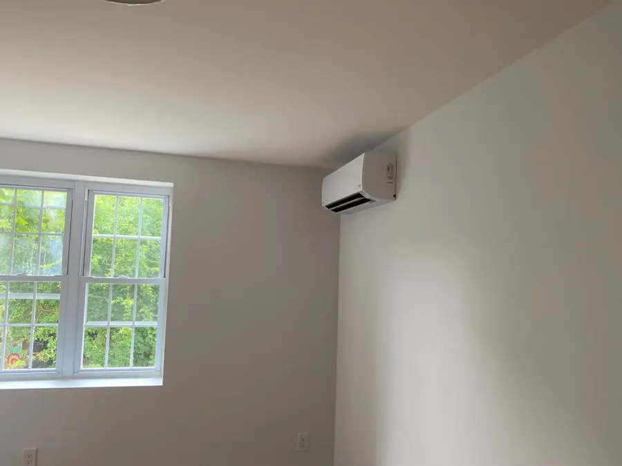 Finished wall-mounted ductless mini-split with closed cover