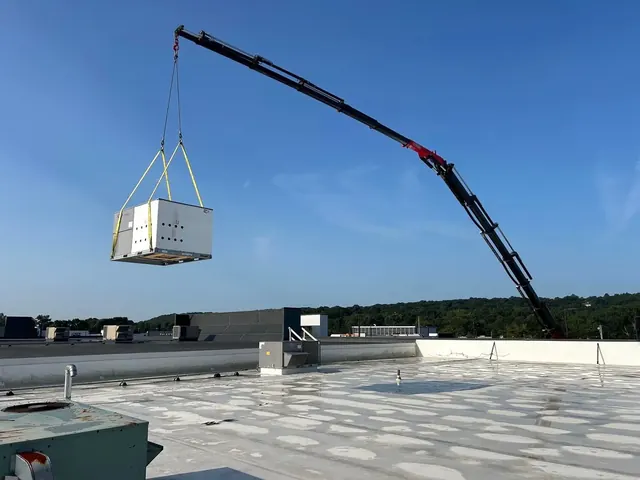 Crane-assisted rooftop installation